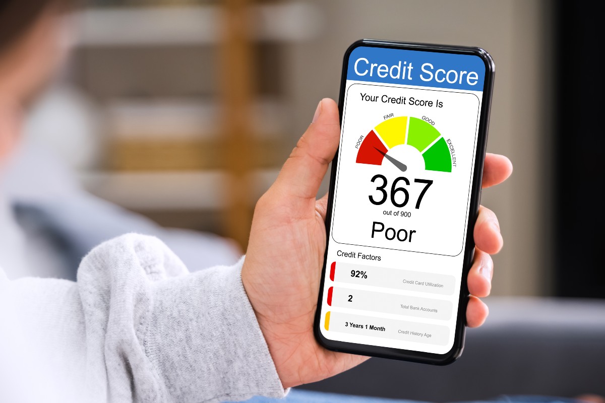 Individual checking credit score on cellphone.