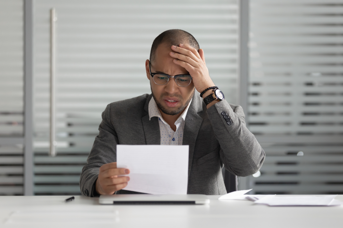 Stressed-out man battling with loan anxiety.